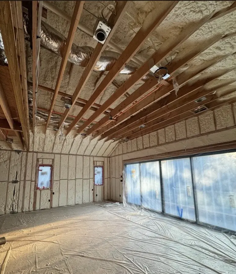 Interior walls and ceiling insulated with spray foam during new construction in Crescent City